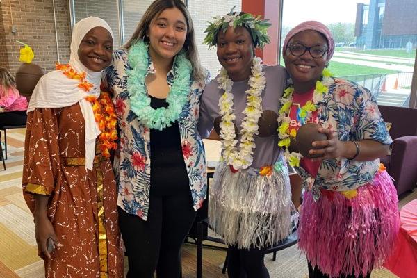 a group of women wearing colorful dresses